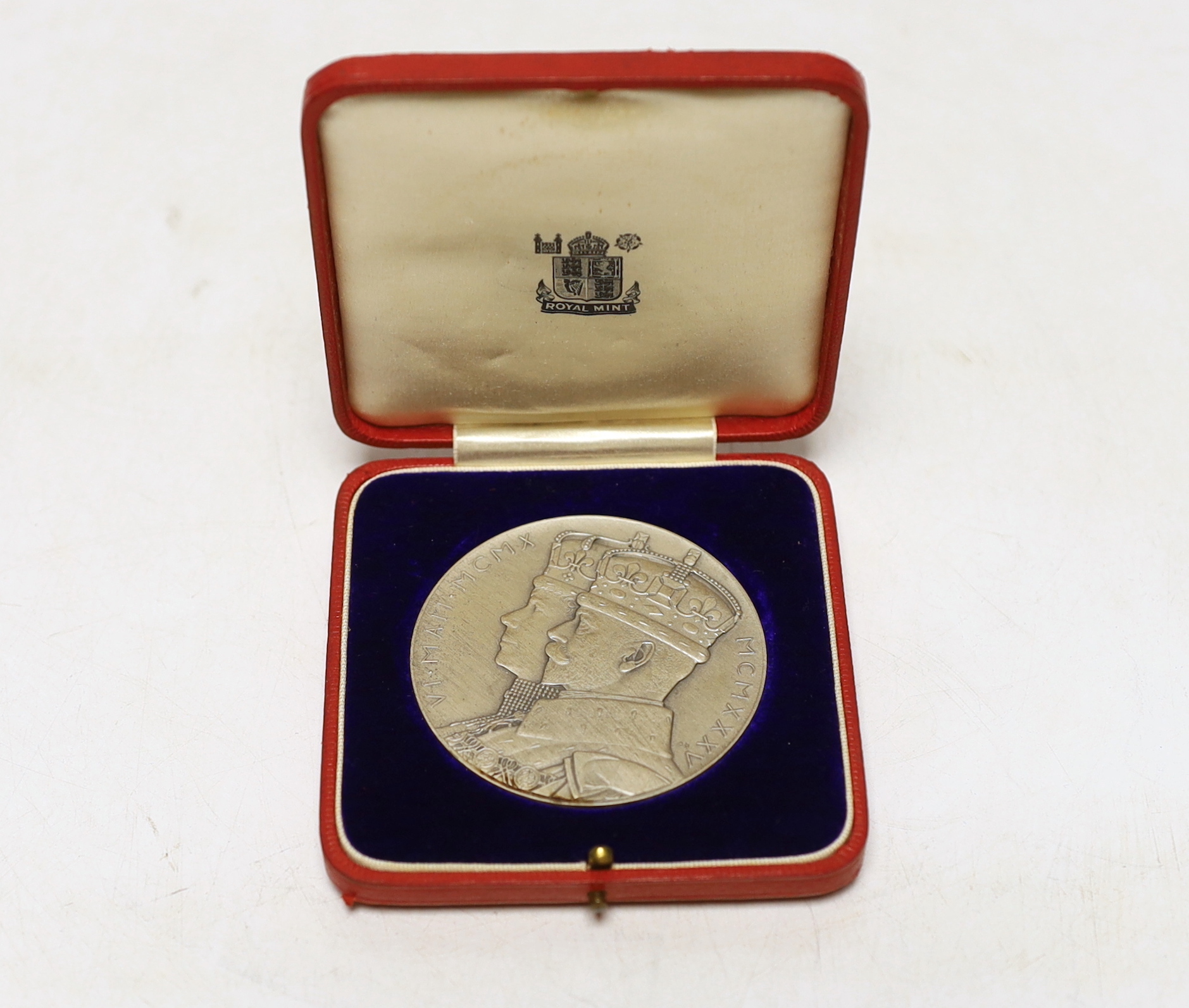 A George V and Queen Mary silver jubilee commemorative silver medal with case